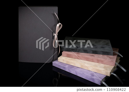 Best gift for men. Man gift concept. Various notebooks with craft gift box black background. Copy space text. Valentine's day, wedding, birthday and special occasion gift concept. Copy space for text. 110908422