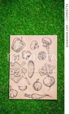 a paper bag lies on the green grass with fruits and vegetables around, moss, mock up a paper bag lies on the green grass with fruits and vegetables around, moss, mock up 110908754