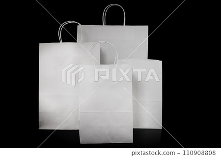 Set of paper bags for shopping on black background. Mockup for design Set of paper bags for shopping on black background. Mockup for design 110908808