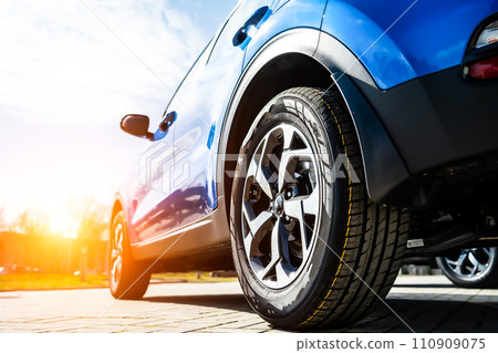 Blue Family business spotrs hatchback Car on sunset. Business success concept Blue Family business spotrs hatchback Car on sunset. Business success concept 110909075