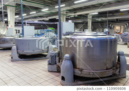 A hydraulic extractor loaded with bags of women's tights. A hydraulic extractor loaded with bags of women's tights. 110909806