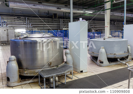 A hydraulic extractor loaded with bags of women's tights. A hydraulic extractor loaded with bags of women's tights. 110909808
