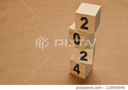 2024 numbers on wooden cube blocks stack on brown background. New Year 2024 Concept 110909840