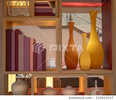 Shabby chic interior decor in pitcher, lantern and wooden letters on a vintage shelf over pastel wall home decoration Shabby chic interior decor in pitcher, lantern and wooden letters on a vintage shelf over pastel wall home decoration 110910527
