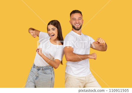 Glad young european guy and lady in white t-shirts have fun, enjoy free time 110911505