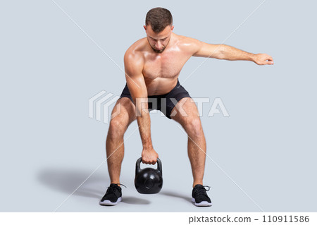 Focused sweat strong muscular young caucasian man with naked torso make exercises Focused sweat strong muscular young caucasian man with naked torso make exercises 110911586