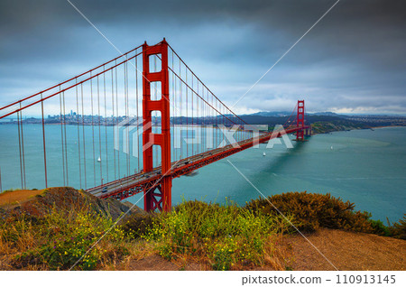 Golden Gate Bridge on a cloudy day with San Francisco skyline in the background Golden Gate Bridge on a cloudy day with San Francisco skyline in the background 110913145