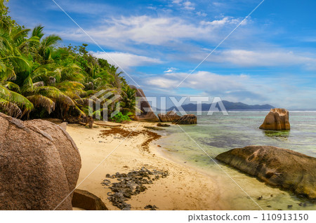 Anse Source D'argent beach with palm trees at La Digue Island, Seychelles Anse Source D'argent beach with palm trees at La Digue Island, Seychelles 110913150