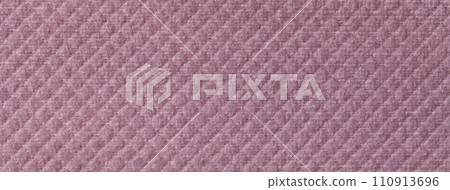 Texture of purple fluffy fabric background with rhomboid pattern, macro. Abstract lilac backdrop Texture of purple fluffy fabric background with rhomboid pattern, macro. Abstract lilac backdrop 110913696