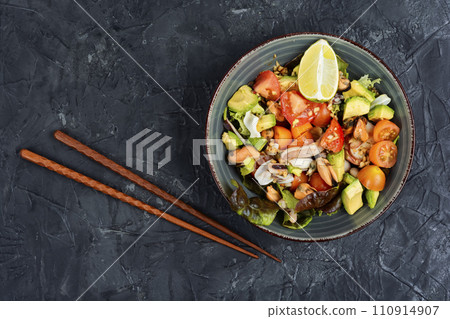 Vegetable salad with seafood. 110914907