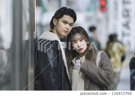 young man and woman looking at camera young man and woman looking at camera 110915760
