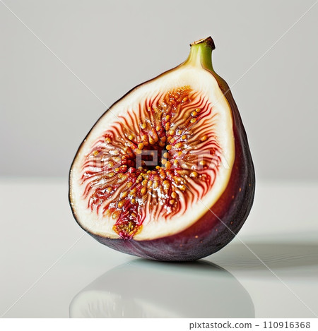 Half of a purple fig isolated on white background Half of a purple fig isolated on white background 110916368