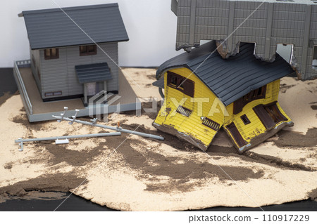 Wooden houses and buildings collapsed in the earthquake 110917229