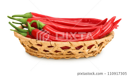 red hot chili pepper in wicker basket isolated on white background. 110917305