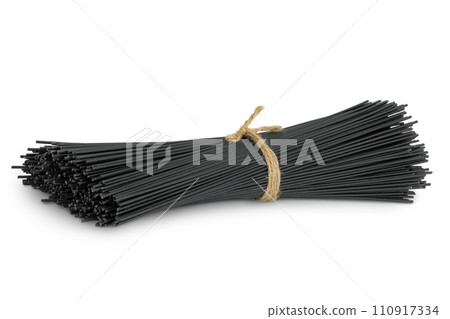 uncooked black spaghetti isolated on white background 110917334