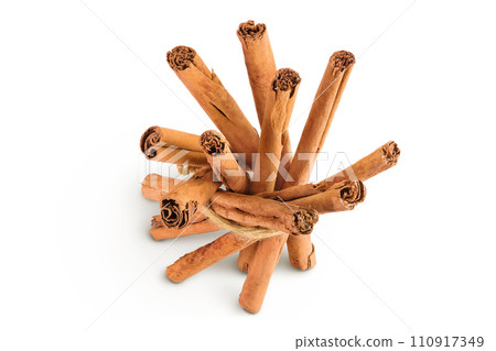 Cinnamon sticks isolated on white background with full depth of field. Top view. Flat lay. Cinnamon sticks isolated on white background with full depth of field. Top view. Flat lay. 110917349