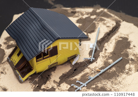 Image of a wooden house damaged by an earthquake Image of a wooden house damaged by an earthquake 110917448