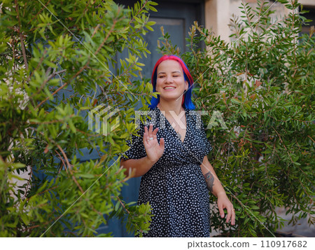 female summer old town walk in Antalya Turkey. woman with colorful hair and dress gracefully explores its historic streets. creating visual symphony that harmonizes past and present. female summer old town walk in Antalya Turkey. woman with colorful hair and dress gracefully explores its historic streets. creating visual symphony that harmonizes past and present. 110917682