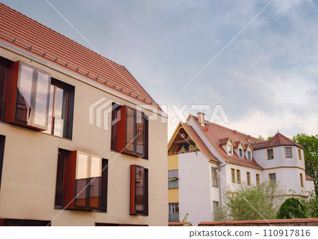 spring trip to Europe. Travel and German sightseeing locations. scenic view to facade of old historic houses somewhere in Erfurt city, Traditional half-timbered houses makes cozy and fairy tail mood 110917816
