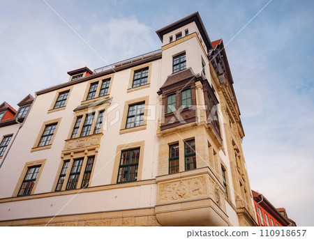 spring trip to Europe. Travel and German sightseeing locations. scenic view to facade of old historic houses somewhere in Erfurt city, Traditional half-timbered houses makes cozy and fairy tail mood spring trip to Europe. Travel and German sightseeing locations. scenic view to facade of old historic houses somewhere in Erfurt city, Traditional half-timbered houses makes cozy and fairy tail mood 110918657