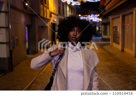 Nighttime Stroll in the City: Confidence and Style 110919458