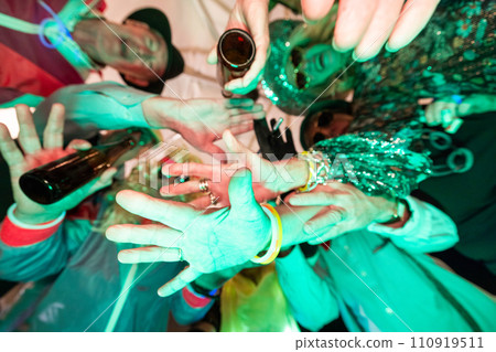 Glow of Togetherness: Hands in Festive Unity 110919511