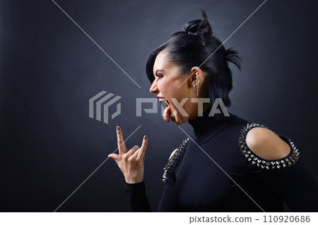 Beautiful woman punk on black background. Beautiful woman punk on black background. 110920686