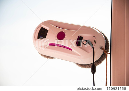 Vacuum glass washer robot washes pvc frame, modern device. Copy space for text, sun 110921566