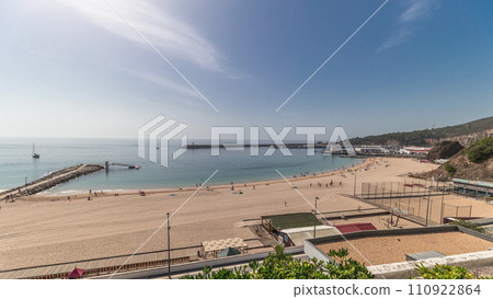 Panorama showing the coastline of the village of Sesimbra timelapse. Portugal 110922864