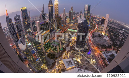 Skyline panorama of the high-rise buildings on Sheikh Zayed Road in Dubai aerial day to night timelapse, UAE. 110922911