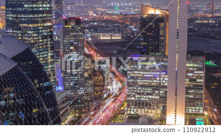 Skyline view of the high-rise buildings in International Financial Centre in Dubai aerial day to night timelapse, UAE. 110922912