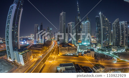 Aerial view of Dubai Downtown skyline with many towers all night timelapse. 110922929