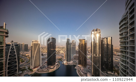 Sunrise over tall residential buildings at JLT aerial all day timelapse Sunrise over tall residential buildings at JLT aerial all day timelapse 110922944