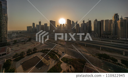 Dubai Marina skyscrapers and Sheikh Zayed road with metro railway aerial timelapse, United Arab Emirates Dubai Marina skyscrapers and Sheikh Zayed road with metro railway aerial timelapse, United Arab Emirates 110922945