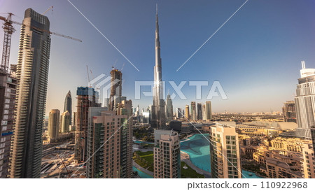 Dubai Downtown cityscape with tallest skyscrapers around aerial all day timelapse. Dubai Downtown cityscape with tallest skyscrapers around aerial all day timelapse. 110922968