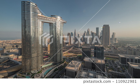 Futuristic Dubai Downtown and financial district skyline aerial night to day timelapse. 110922981
