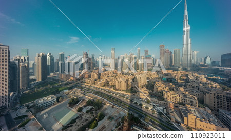Dubai Downtown night to day timelapse with tallest skyscraper and other towers Dubai Downtown night to day timelapse with tallest skyscraper and other towers 110923011