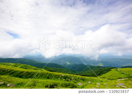 wonderful alpine landscape of ukraine in summer. clouds above the rolling hills and green meadows of carpathian mountains 110923837