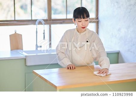 Young woman wiping and cleaning the room 110923998