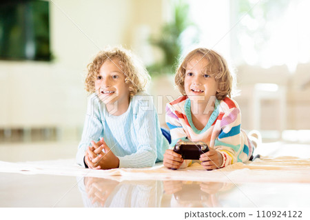 Kids play video game. Children with controller. 110924122