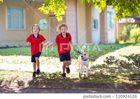 Child walking dog. Kids and puppy. Boy and pet. Child walking dog. Kids and puppy. Boy and pet. 110924129