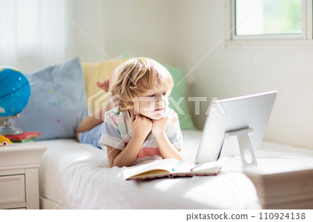 Online remote learning. School kids with computer. Online remote learning. School kids with computer. 110924138