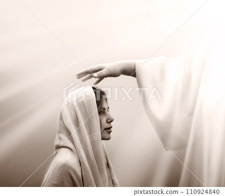 Blessing hand above the head of a woman in a headscarf 110924840