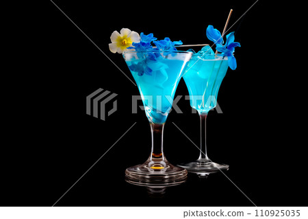 Set of Blue Curacao cocktails garnished with a lime isolated on black background 110925035