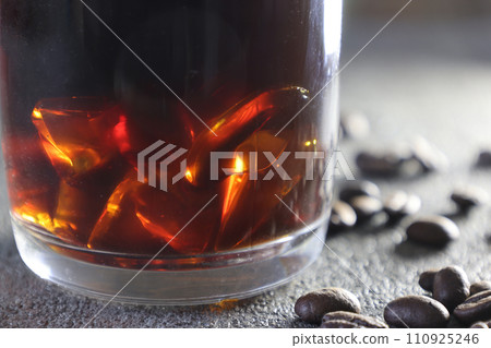 Close-up image of iced coffee on gray background Close-up image of iced coffee on gray background 110925246
