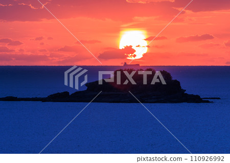 Sunset over the sea and a ship 110926992