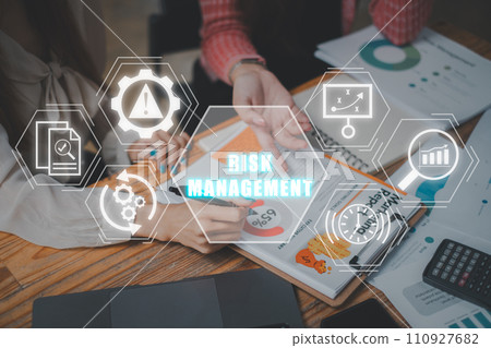 Risk management concept, Business team analyzing financial data on business paper with risk management icon on virtual screen. Standard, Monitoring, Strategy, Analysis, Control, Evaluation, Project. 110927682