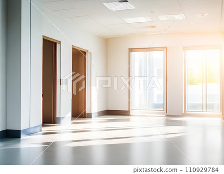 Light blurred background. The hall of an office or medical institution with panoramic windows and a perspective. 110929784