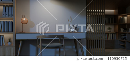 Modern, luxury home office at night with a table, an armchair, a bookshelf, and a home library Modern, luxury home office at night with a table, an armchair, a bookshelf, and a home library 110930715