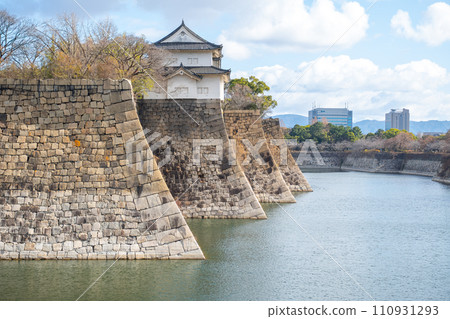 Osaka castle famous japanese castle landmark in Osaka City, Kansai, Japan with blue sky background Osaka castle famous japanese castle landmark in Osaka City, Kansai, Japan with blue sky background 110931293